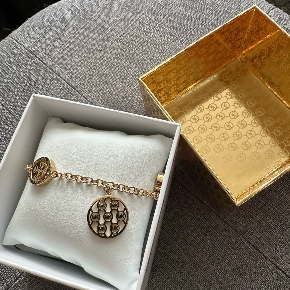 Gold Michael Kors stainless steel charm bracelet